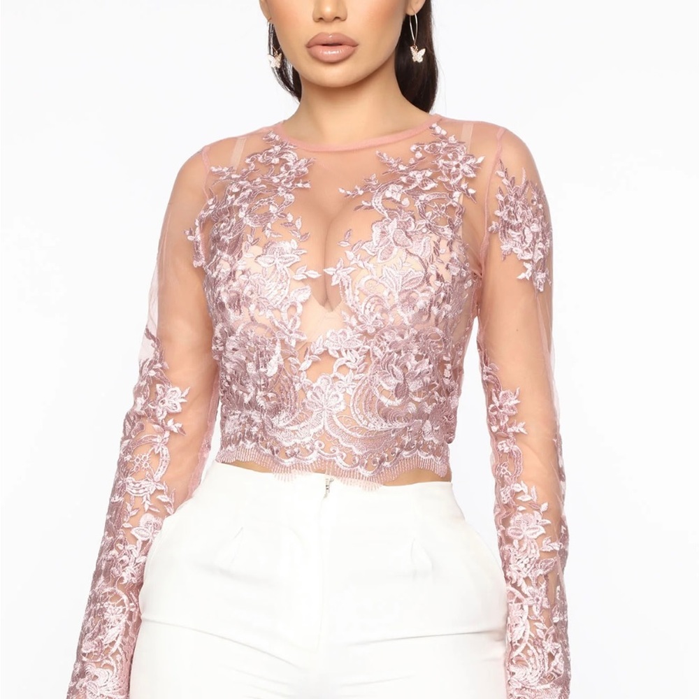 Women’s lace top, zips up at the back and is a bit cropped.